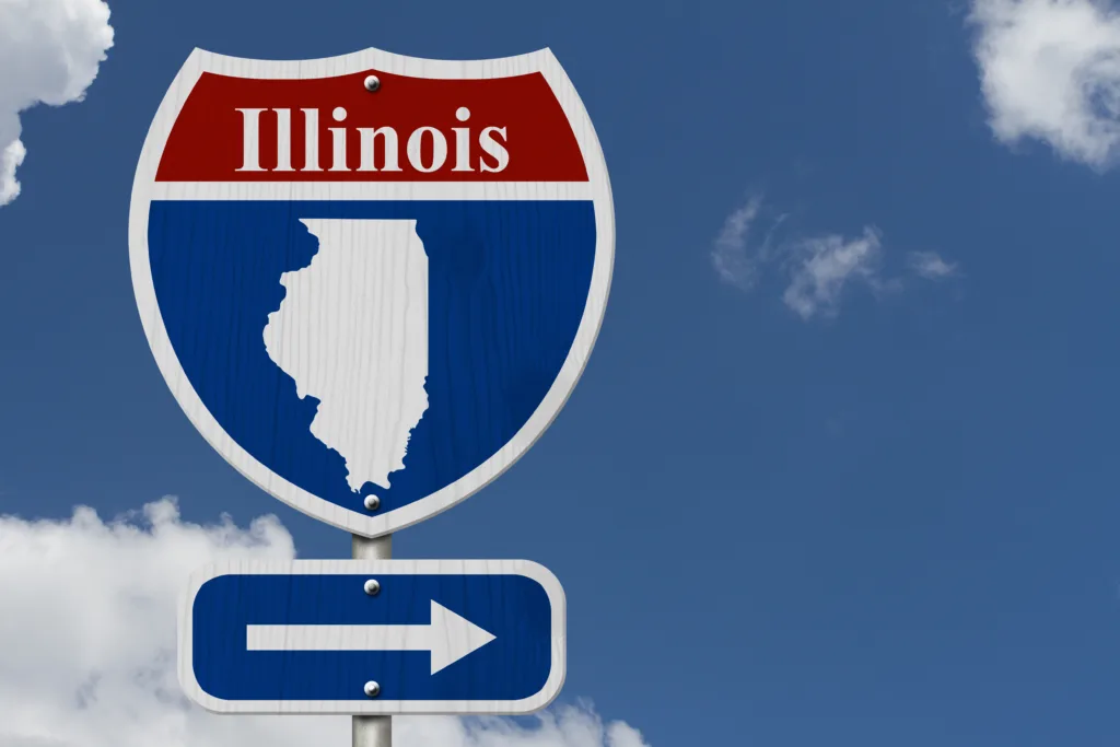 Road trip to Illinois, Red, white and blue interstate highway road sign with word Illinois and map of Illinois with sky background